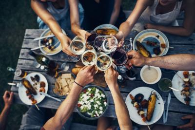 Image of table with people drinking wine
